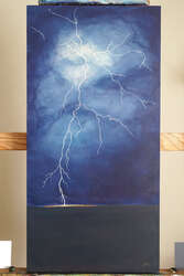 Painting of a discharge of lightning over and striking a prairie.