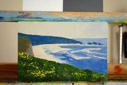 Painting of ocean coastline and cliffs atop a cliff.